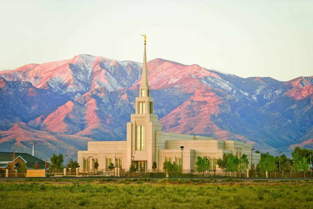 Temple in front of mountains at sunset